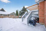 Enjoy the winter wonderland from this charming property! This home features a spacious deck, perfect for enjoying the snowy landscape.