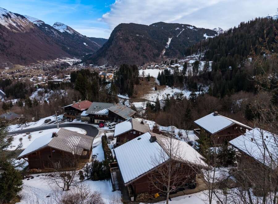 Nestled in a picturesque mountain setting, this charming property offers a serene escape.