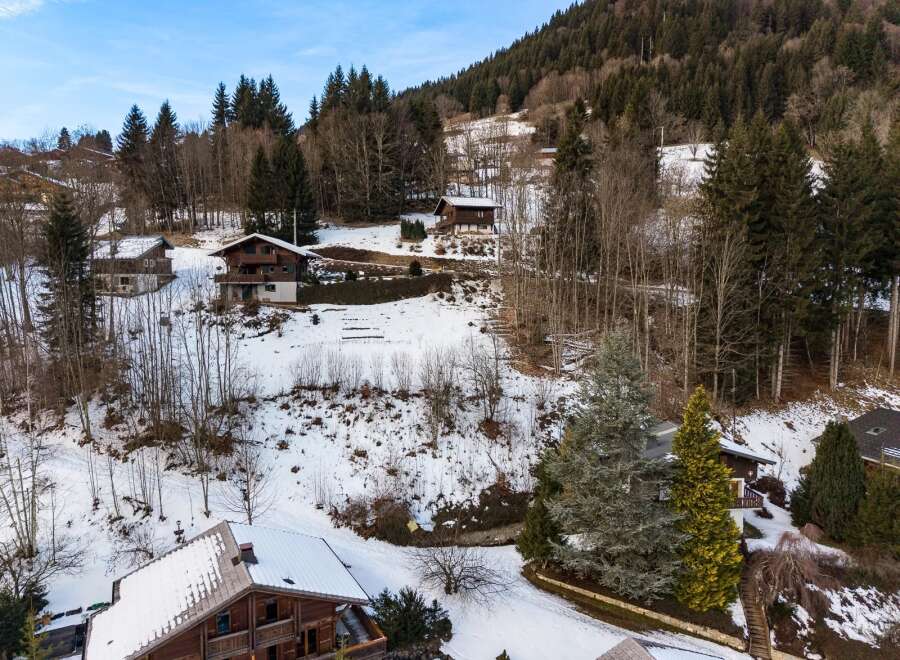 Nestled amidst a serene, snow-covered landscape, this charming property offers a tranquil escape.