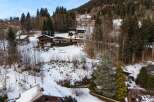 Nestled amidst a serene, snow-covered landscape, this charming property offers a tranquil escape.