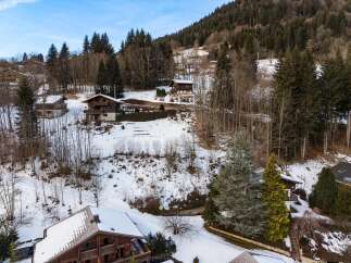 Nestled amidst a serene, snow-covered landscape, this charming property offers a tranquil escape.