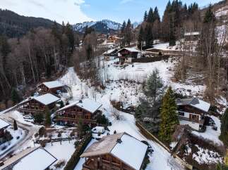 Discover the charm of mountain living in this stunning chalet nestled in a picturesque winter wonderland.
