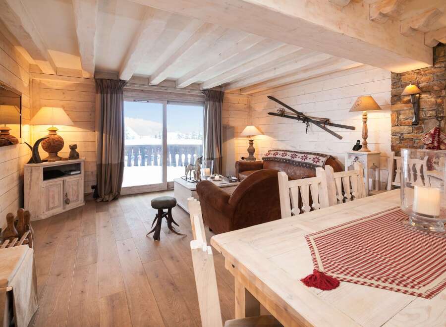 Experience the charm of this cozy chalet, featuring a warm and inviting living space.