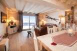 Experience the charm of this cozy chalet, featuring a warm and inviting living space.