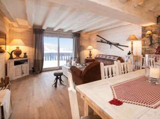 Experience the charm of this cozy chalet, featuring a warm and inviting living space.