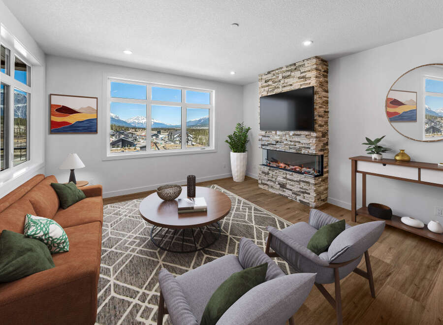 Step into luxury with this stunning living room, boasting a modern fireplace and expansive windows that frame breathtaking mountain views.