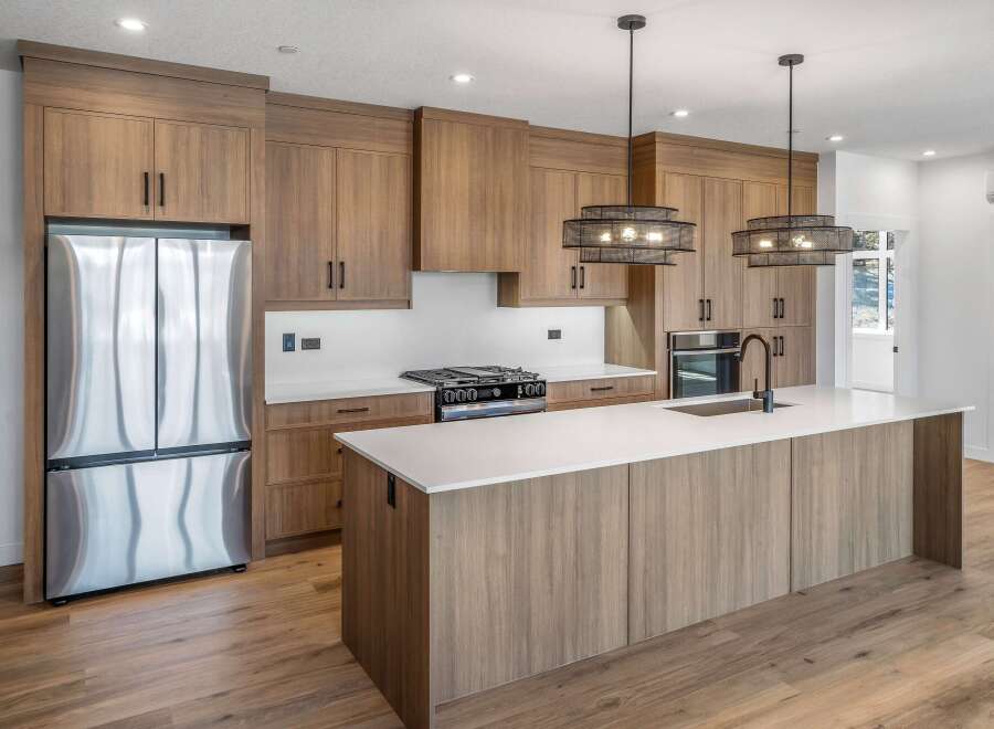 This stunning kitchen boasts modern design with sleek cabinetry and a spacious island, perfect for culinary enthusiasts.