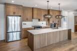 This stunning kitchen boasts modern design with sleek cabinetry and a spacious island, perfect for culinary enthusiasts.
