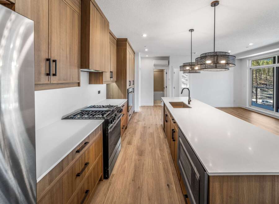 This stunning kitchen boasts modern design with sleek cabinetry and a spacious island, perfect for culinary enthusiasts.