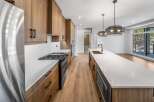 This stunning kitchen boasts modern design with sleek cabinetry and a spacious island, perfect for culinary enthusiasts.