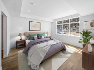 Step into this beautifully designed bedroom, featuring a serene color palette and modern aesthetic.