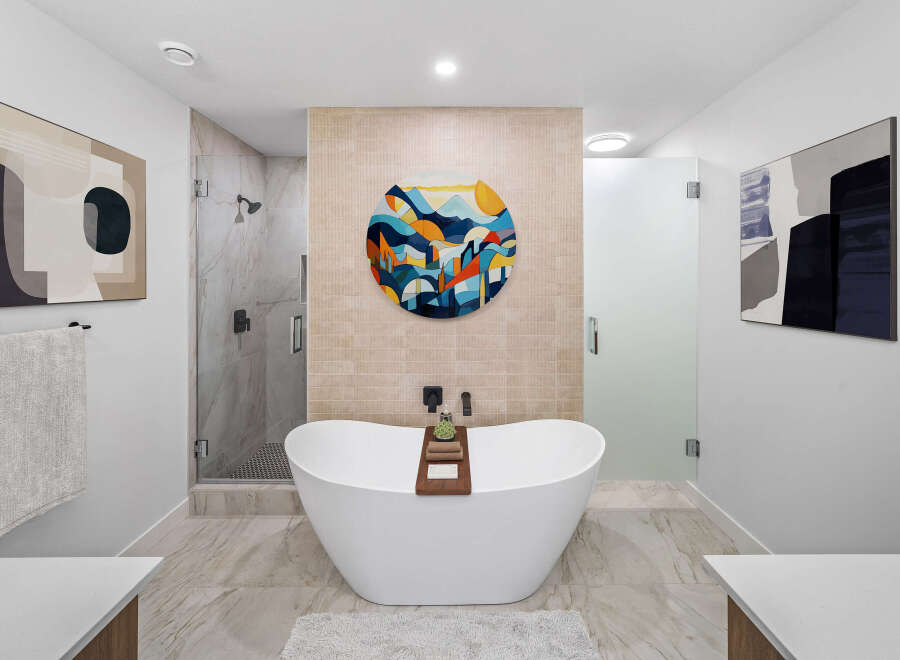 Step into luxury with this stunning bathroom, featuring a modern freestanding tub and a separate glass-enclosed shower.