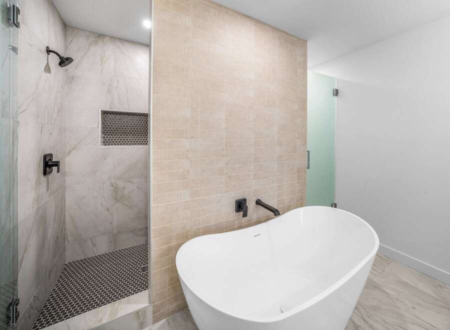 Step into luxury with this stunning bathroom featuring a sleek, modern design.