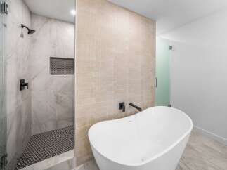 Step into luxury with this stunning bathroom featuring a sleek, modern design.