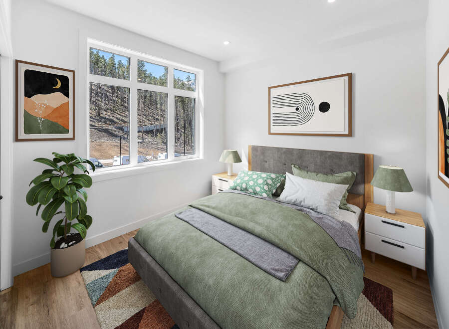 This stunning bedroom boasts a modern design with a serene atmosphere.
