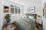 This stunning bedroom boasts a modern design with a serene atmosphere.