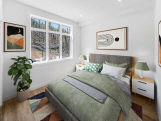 This stunning bedroom boasts a modern design with a serene atmosphere.