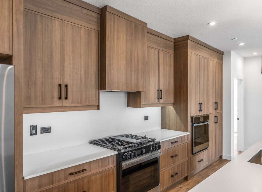 This stunning kitchen boasts custom cabinetry and high-end appliances, perfect for the discerning homeowner.
