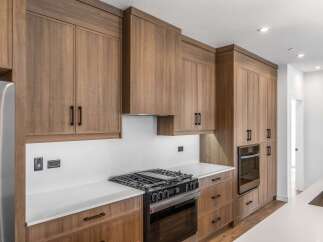 This stunning kitchen boasts custom cabinetry and high-end appliances, perfect for the discerning homeowner.