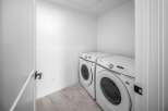 Step into this modern laundry room, featuring a sleek Samsung washer and dryer set.
