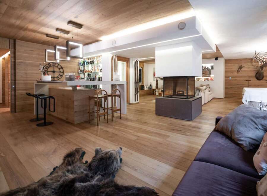 This stunning property boasts a warm and inviting interior, perfect for a luxurious living experience.
