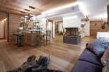 This stunning property boasts a warm and inviting interior, perfect for a luxurious living experience.