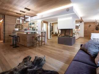 This stunning property boasts a warm and inviting interior, perfect for a luxurious living experience.