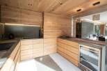This stunning kitchen boasts a modern design with a warm, inviting feel.