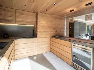 This stunning kitchen boasts a modern design with a warm, inviting feel.