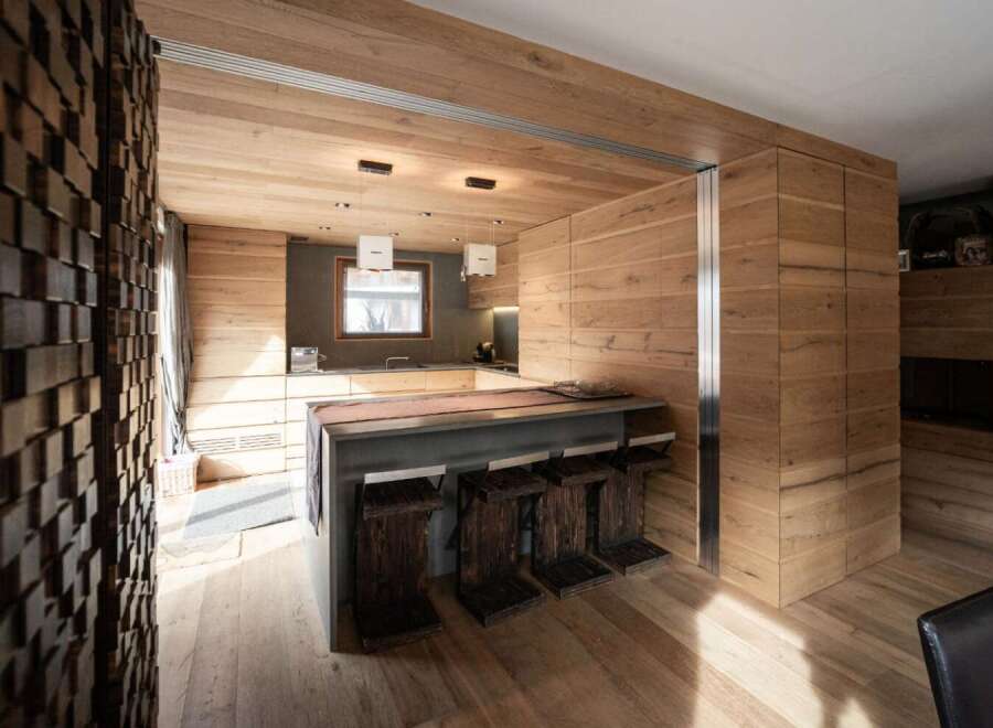 This stunning kitchen boasts a modern design with a warm, inviting atmosphere.