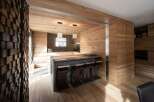 This stunning kitchen boasts a modern design with a warm, inviting atmosphere.