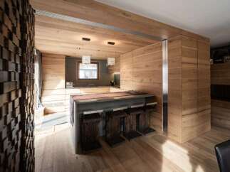 This stunning kitchen boasts a modern design with a warm, inviting atmosphere.