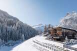 Nestled in a picturesque winter wonderland, this stunning property offers a unique blend of modern design and natural beauty.