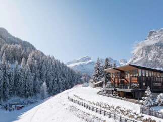 Nestled in a picturesque winter wonderland, this stunning property offers a unique blend of modern design and natural beauty.