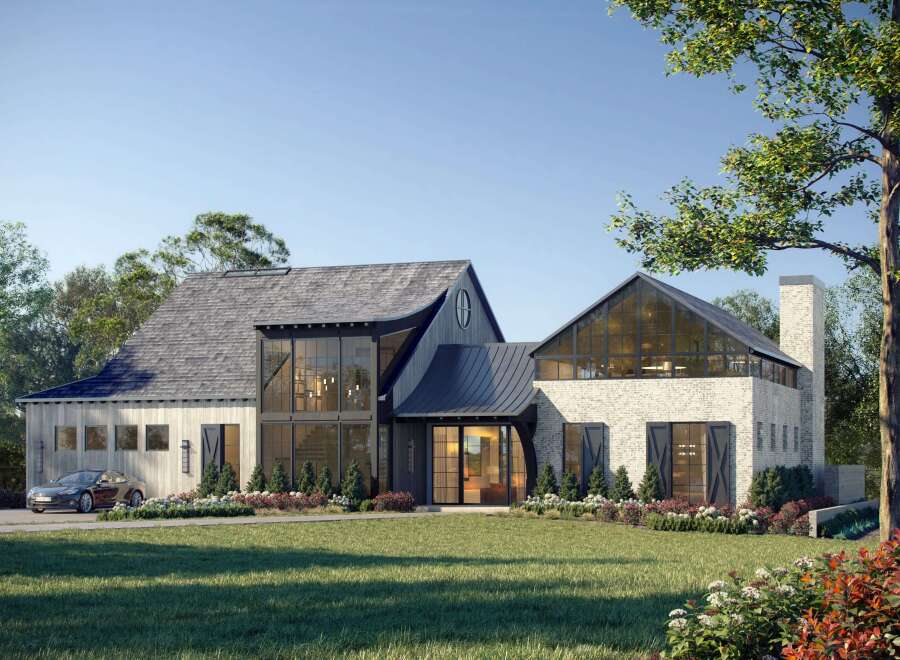 This stunning modern farmhouse boasts a unique architectural design with a blend of textures and styles.