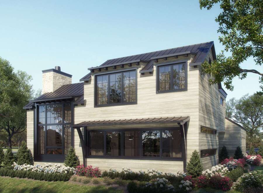 This stunning property boasts a modern farmhouse design with a light-colored exterior and dark trim, creating a striking contrast.