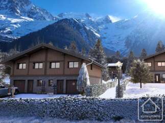 Discover your dream alpine retreat! This stunning property boasts a charming wooden facade, nestled amidst a breathtaking mountain backdrop.