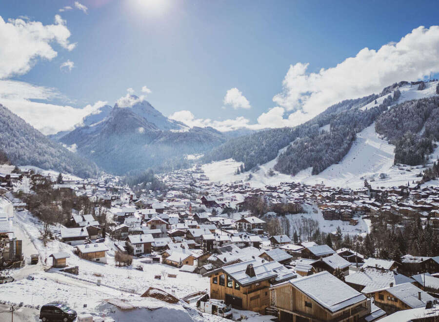 Nestled in a picturesque winter wonderland, this charming property offers stunning views of snow-capped mountains and a quaint village.