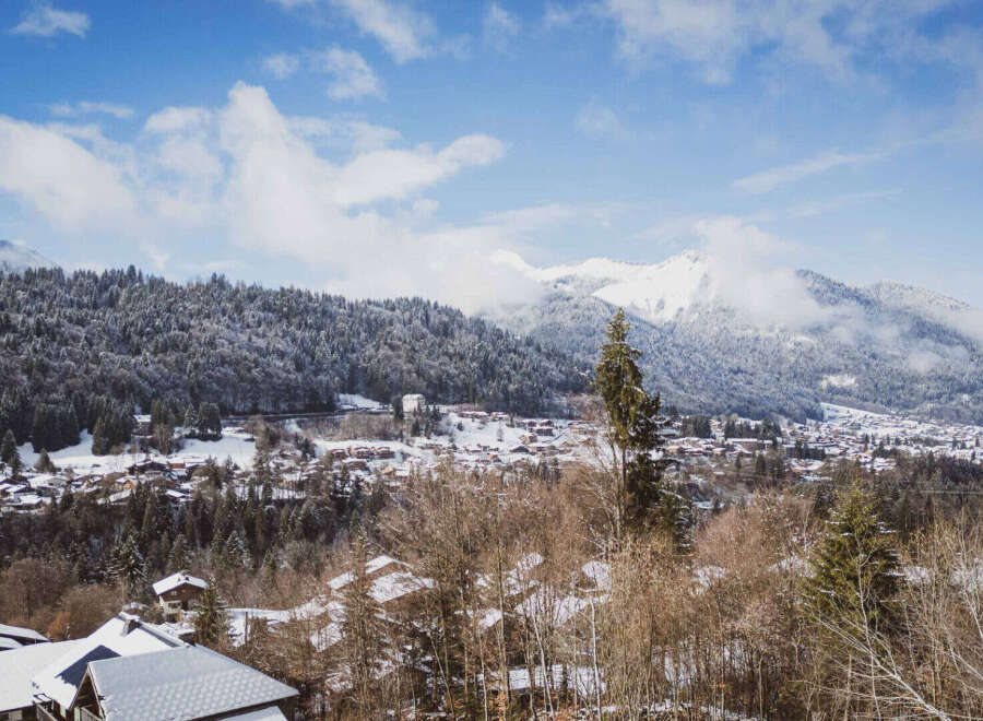 Nestled in a picturesque winter wonderland, this property offers stunning views of snow-capped mountains and a charming village.