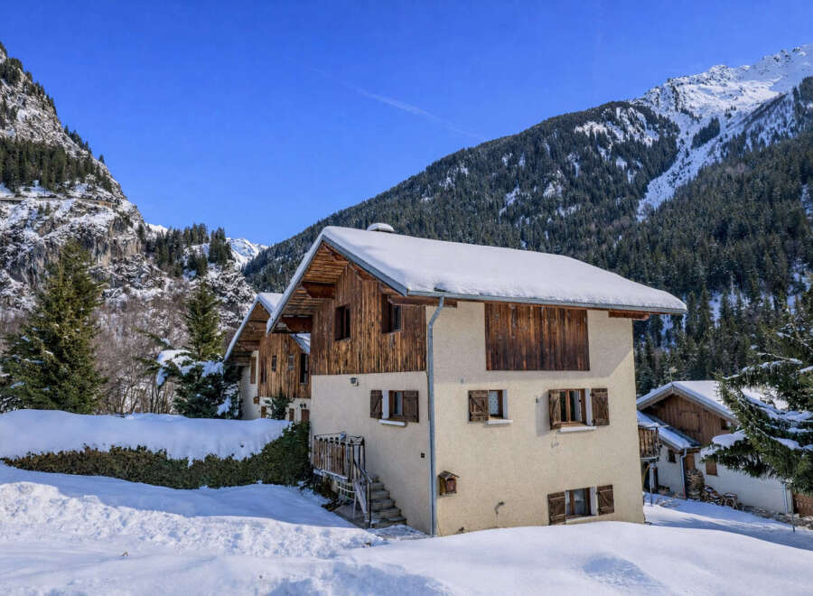 Discover a charming chalet nestled in a picturesque winter wonderland.