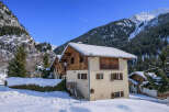 Discover a charming chalet nestled in a picturesque winter wonderland.