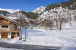Discover the charm of this stunning mountain chalet nestled in a picturesque winter wonderland.