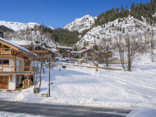 Discover the charm of this stunning mountain chalet nestled in a picturesque winter wonderland.