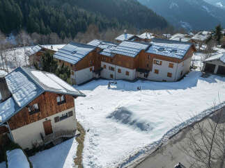 Nestled in a picturesque mountain setting, this charming property offers a serene escape.