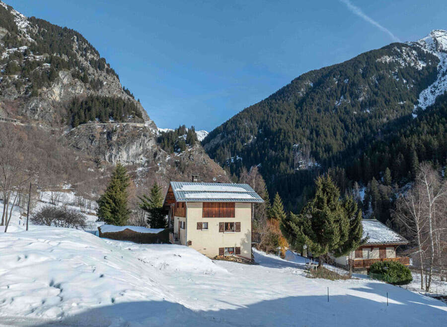 Nestled in a picturesque mountain setting, this charming property offers a serene escape.