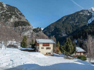 Nestled in a picturesque mountain setting, this charming property offers a serene escape.