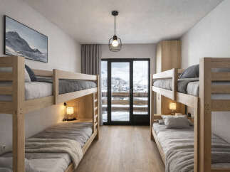 This cozy bedroom features two sets of bunk beds, perfect for accommodating multiple guests or family members.