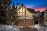 This stunning property boasts a unique architectural design with a charming balcony and a two-car garage.