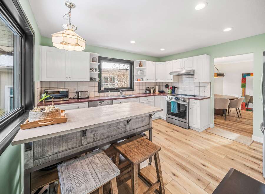Step into this beautifully designed kitchen, featuring a spacious island perfect for meal prep and entertaining.