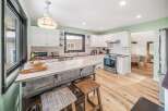 Step into this beautifully designed kitchen, featuring a spacious island perfect for meal prep and entertaining.